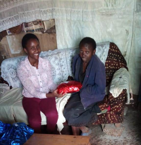 Cathrine's sister {wangare} receiving her gift